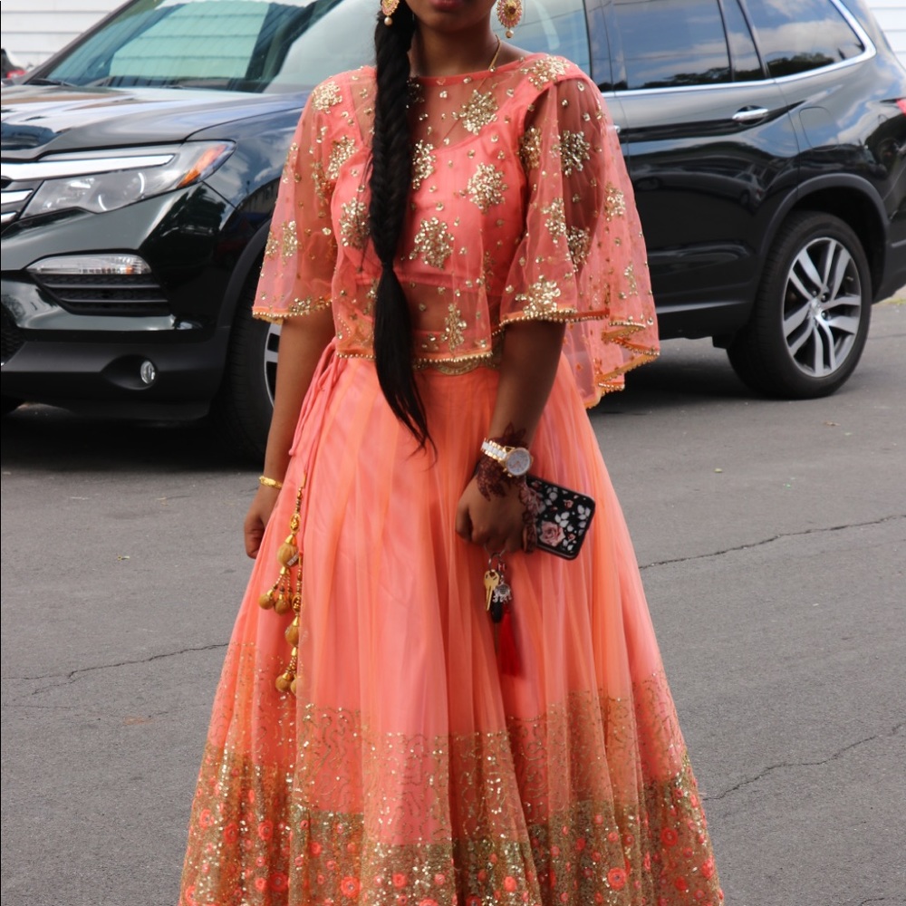 Chic Coral Lehenga with Gold Detailing